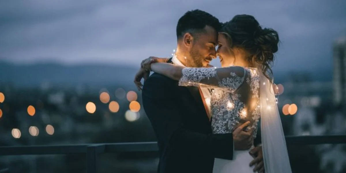 A joyful couple embracing on their wedding day.