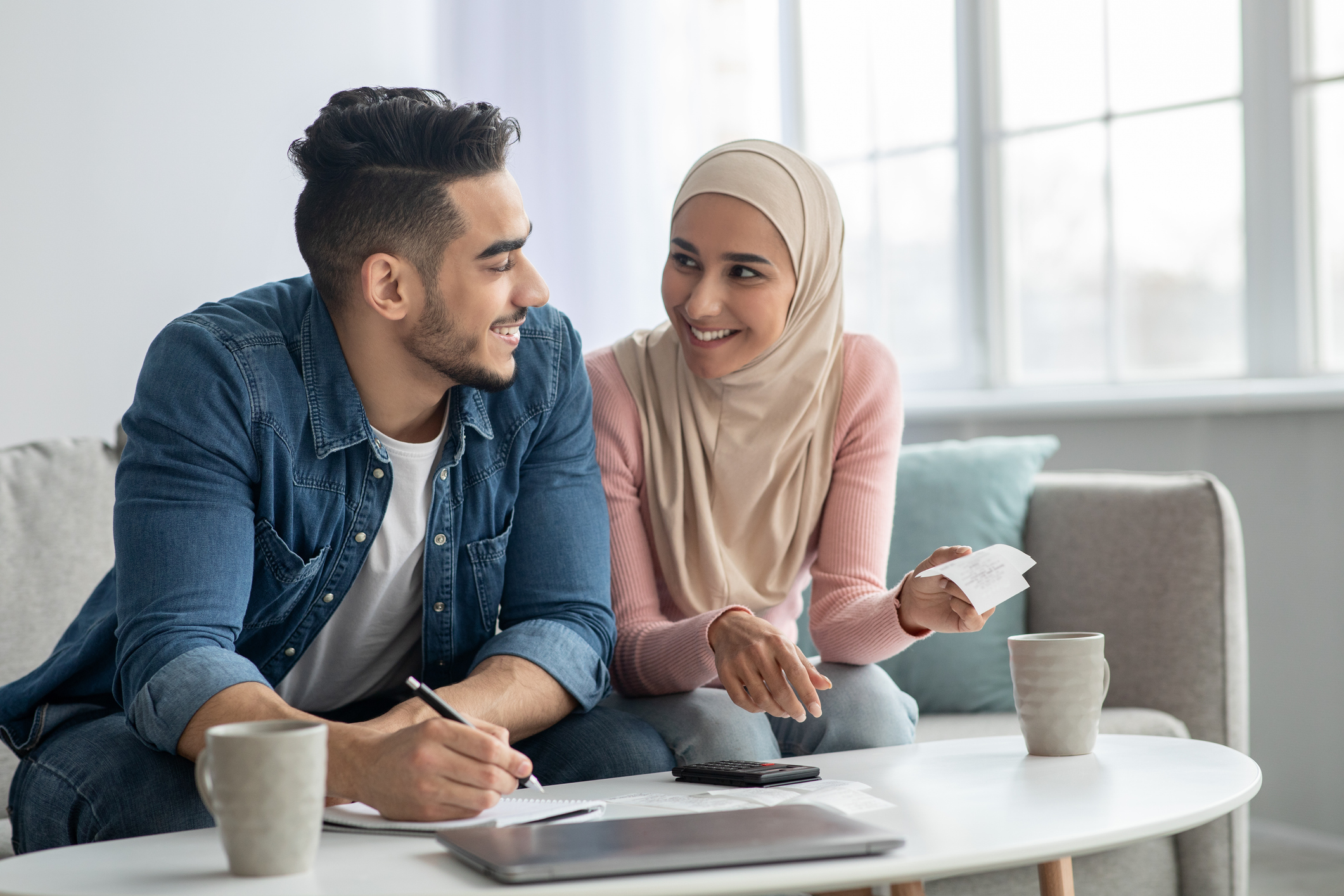 Muslim husband and wife discussing household finances