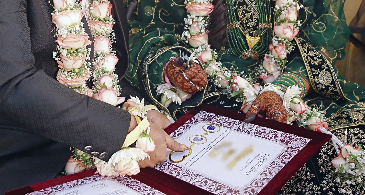Signed Nikah certificate at a Muslim wedding ceremony