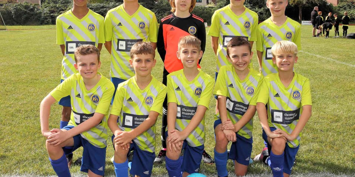 Thomas Mansfield Family Law proudly sponsors St Albans boys football team in 2023/24 - Team posing in front of goal.